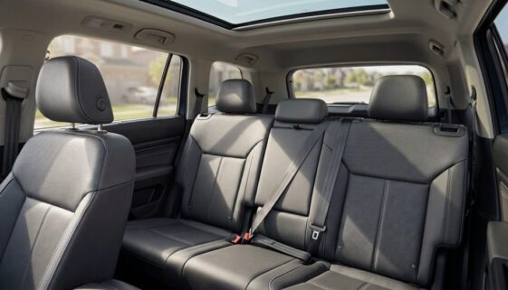 photo of cars' backseat with headrest push down in the middle seat