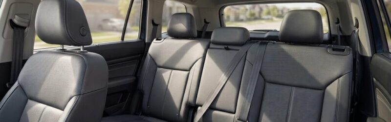 photo of cars' backseat with headrest push down in the middle seat